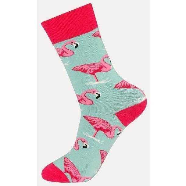 a person is holding a skateboard in their hand