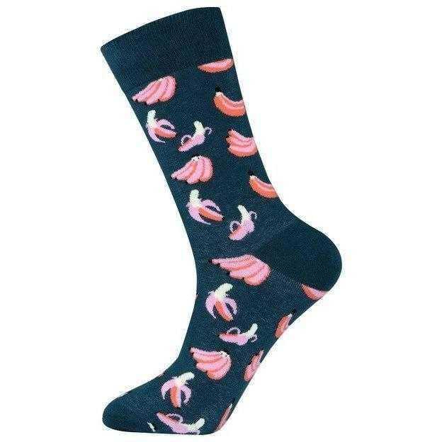 a person is holding a skateboard in the air