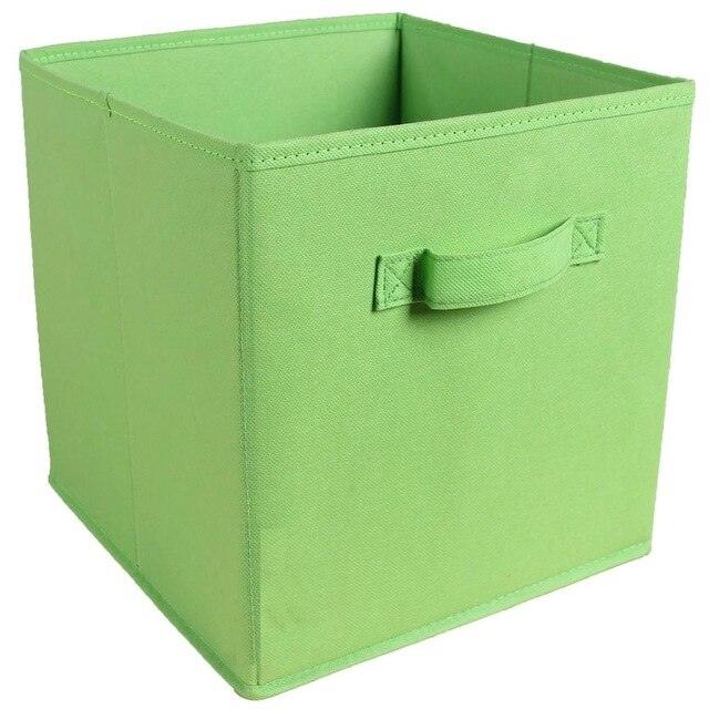 a green umbrella is sitting in a green box