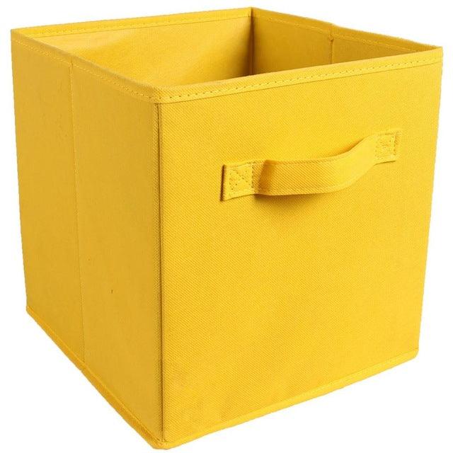 a yellow piece of luggage sitting on top of a yellow box