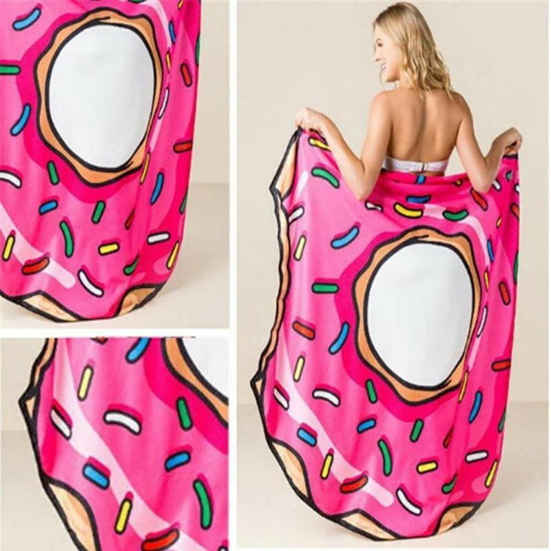 a woman in a pink dress holding a cell phone