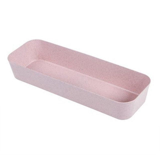 a pink suitcase is sitting on a white surface