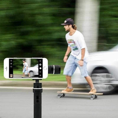 a man riding a skateboard down a street 