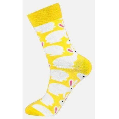 a yellow fire hydrant sitting on top of a table 