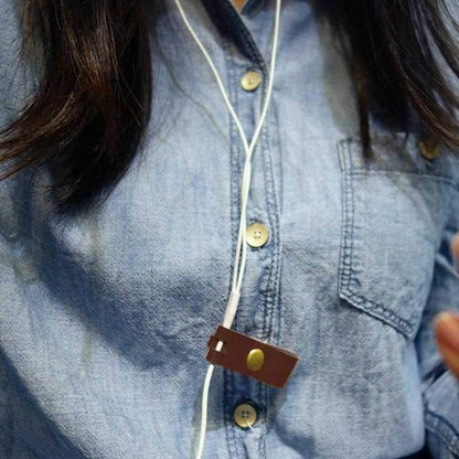 a woman holding a cell phone in her hand 
