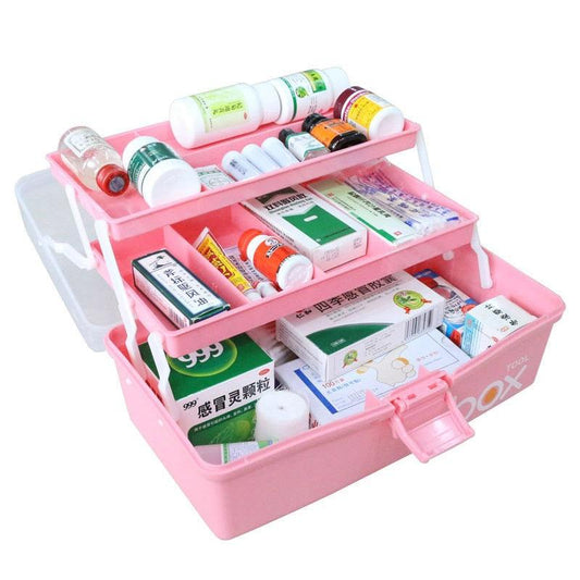 a pink piece of luggage on top of a box 
