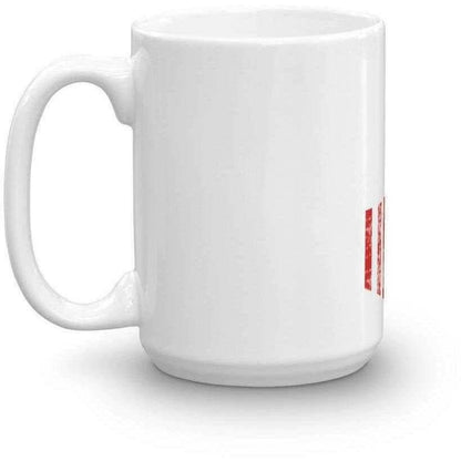 a coffee cup sitting on top of a table 