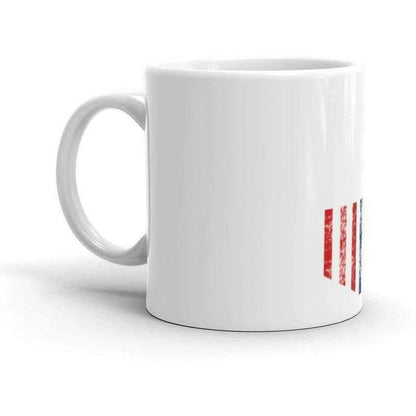 a coffee cup sitting on top of a table 