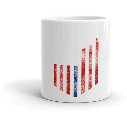 a white cup filled with red and white toothbrushes 