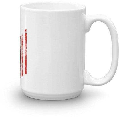 a coffee cup sitting next to a coffee cup 