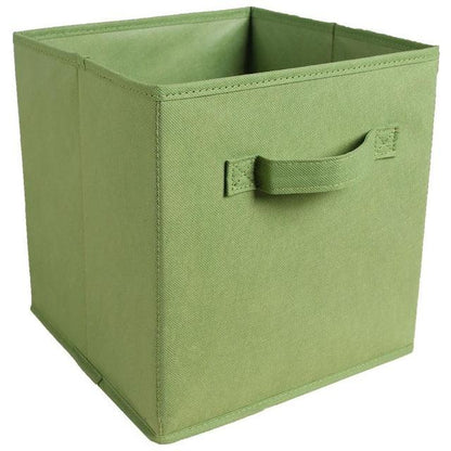 a green suitcase sitting on top of a green box 