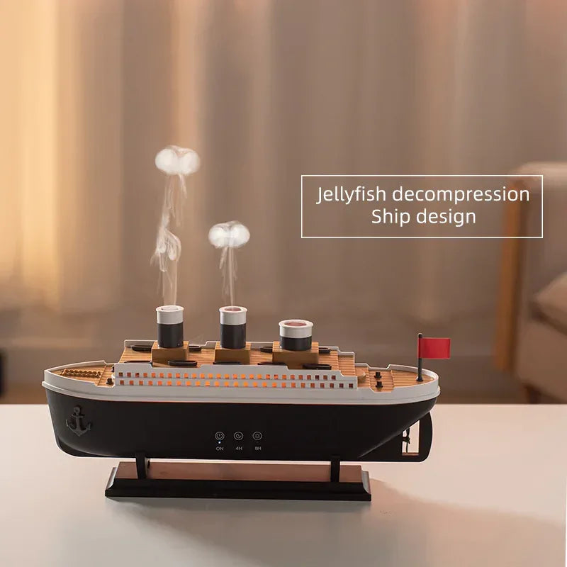 AromaMist ship diffuser with two jellyfish-shaped mist clouds rising above it, with the text jellyfish decompression and ship design