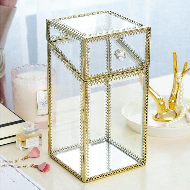 a glass table with a glass and a purse 