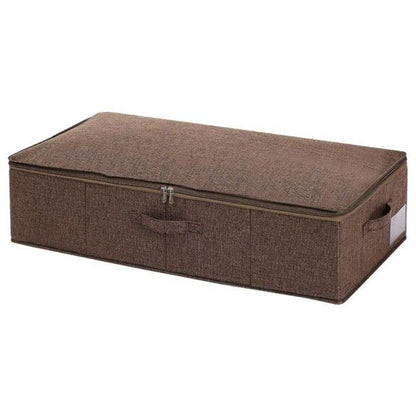 a brown piece of luggage sitting on top of a box 