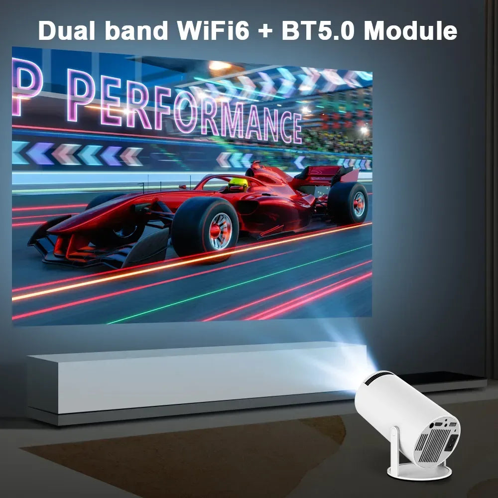 White home projector casting a racing car scene on a wall, with dual-band WiFi 6 and Bluetooth 5.0 text banner.